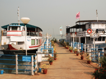 Serene view of docked boats at Lumbini Park, bathed in the afternoon sunlight